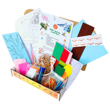 Load image into Gallery viewer, Spring-themed Craft kit with colourful materials and instructions on a white background